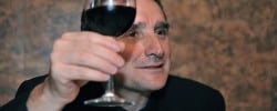 Toasting Traditions in France - Man raises a glass, must maintain eye contact