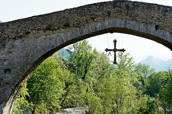 Asturian Cross hanging beneath bridge