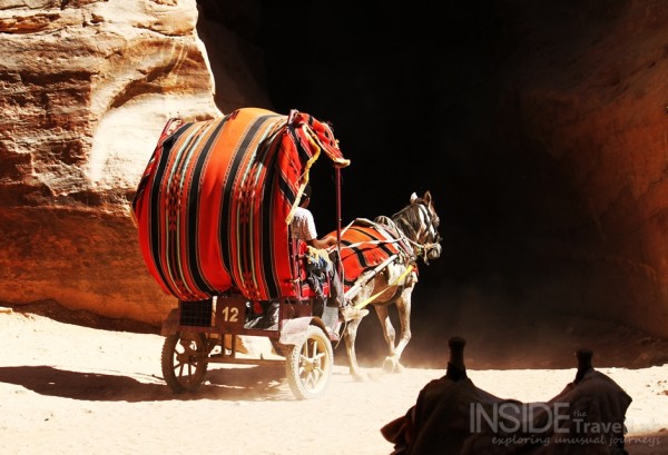 Entering the siq on horseback in Petra Entering the siq on horseback in Petra