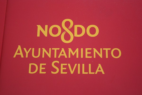 Yellow gold NO8DO text on the town hall in Seville