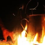 Traditional Jordanian kettle on open fire while making Arabic coffee in Jordan