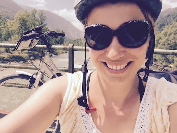 Abi cycling in Austria wearing a cycling helmet