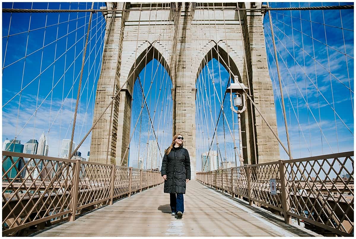 Abi from Inside the Travel Lab walking across the Brooklyn Bridge