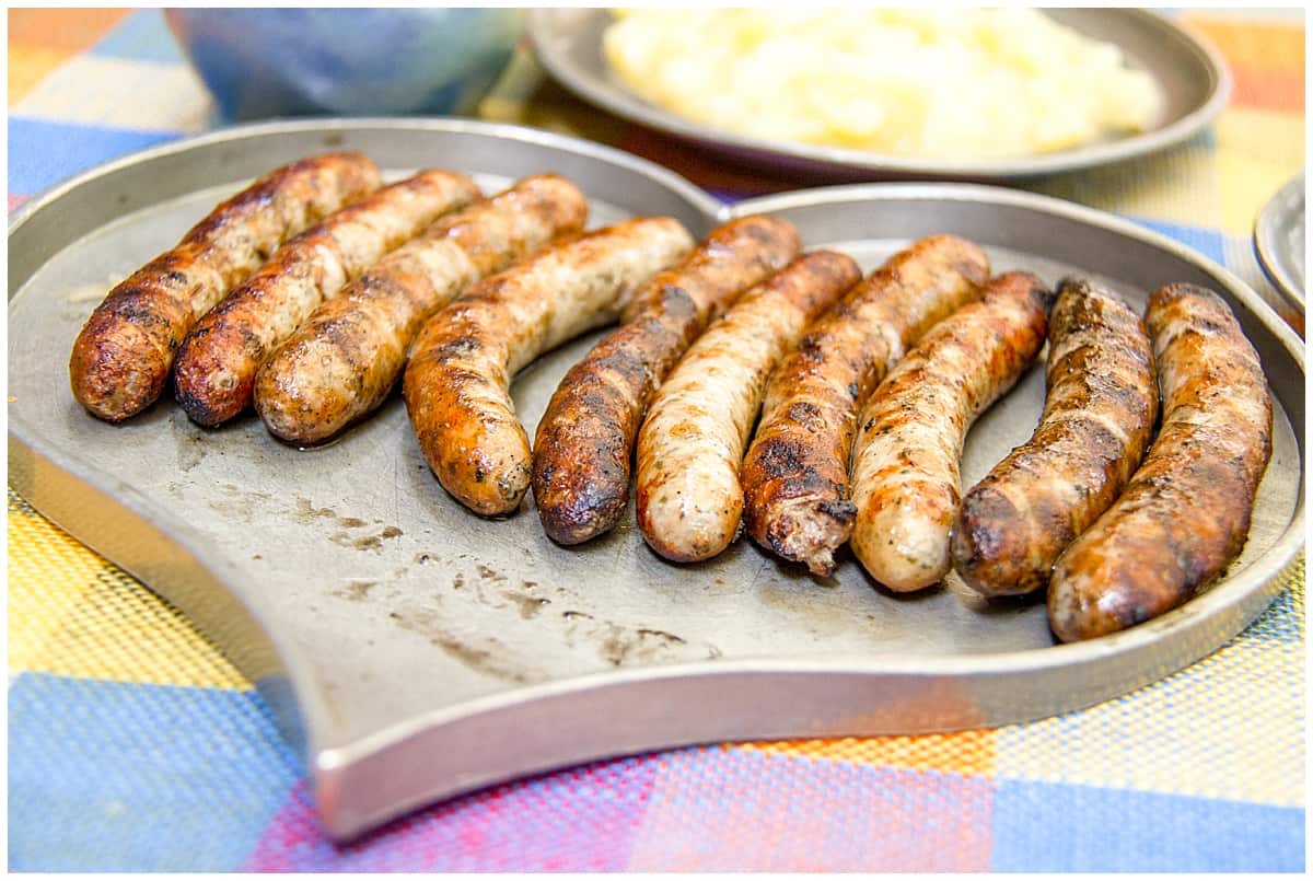 Heart shaped pewter serving dish with Nuremberg sausages