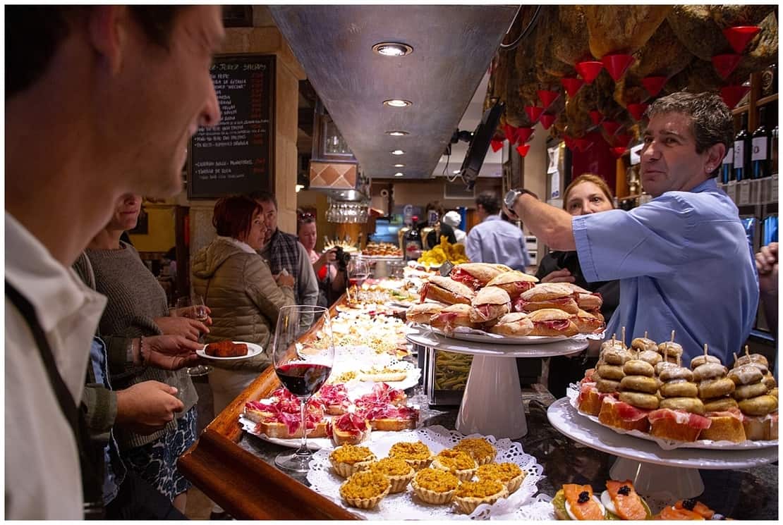 People drinking and eating tapas in Donostia San Sebastian, Spain