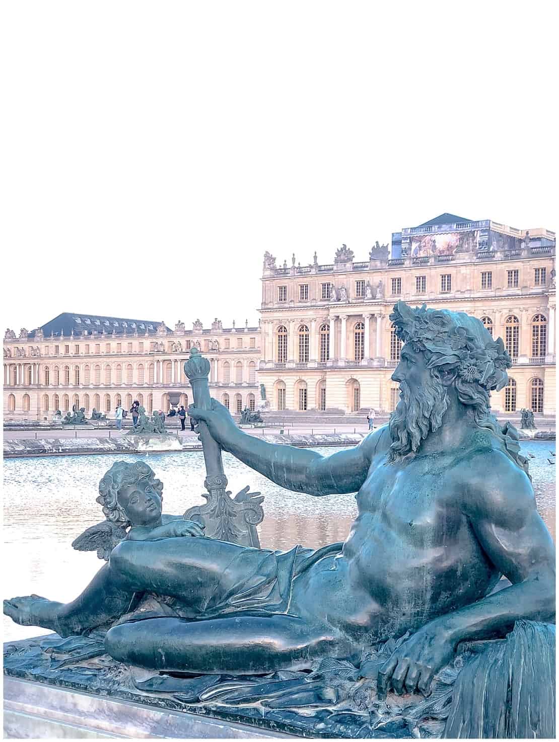 Versailles day trip from Paris - Neptune reclining in front of Palace of Versailles