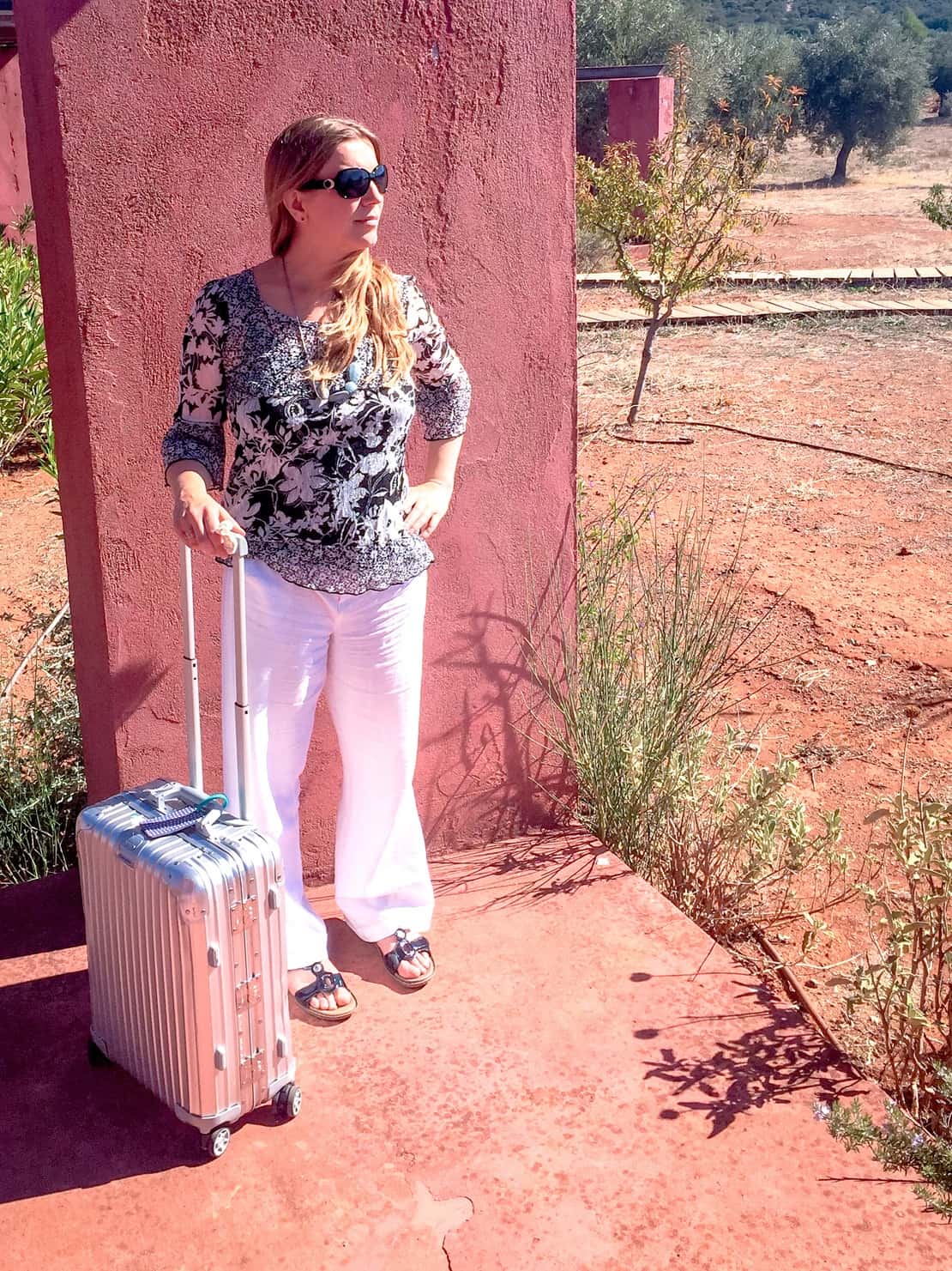 Abigail King with Rimowa suitcase for cabin luggage