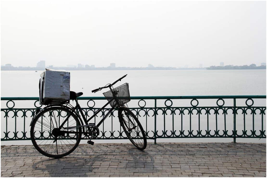 Bicycle by Tran Quoc Pagoda lakeside in Hanoi Vietnam