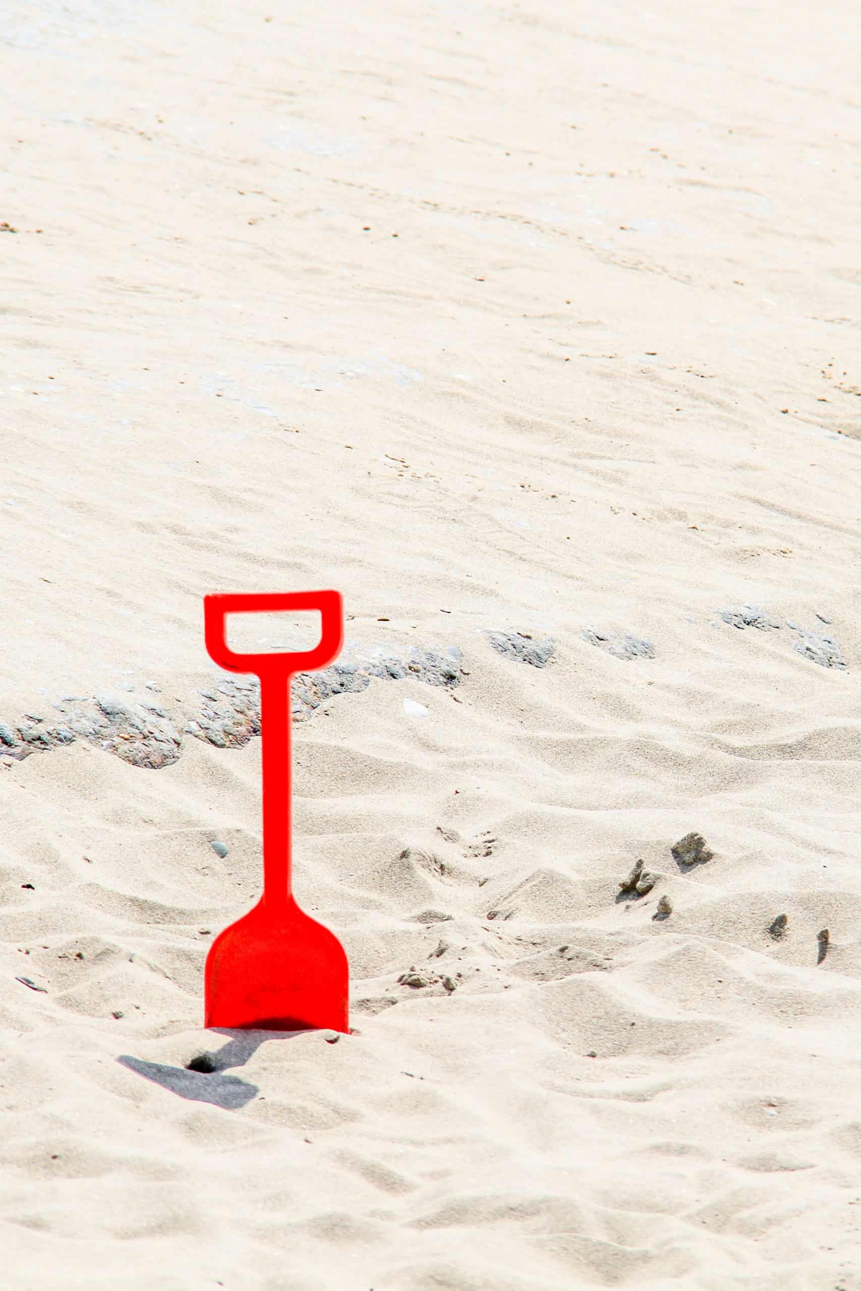 Summer bucket list - spade in sand