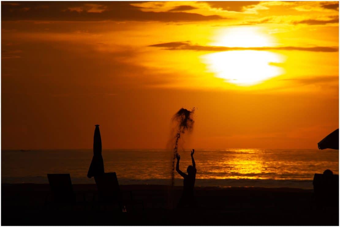 Sunset captions and sunset quotes-Sabah sunset with boy throwing sand