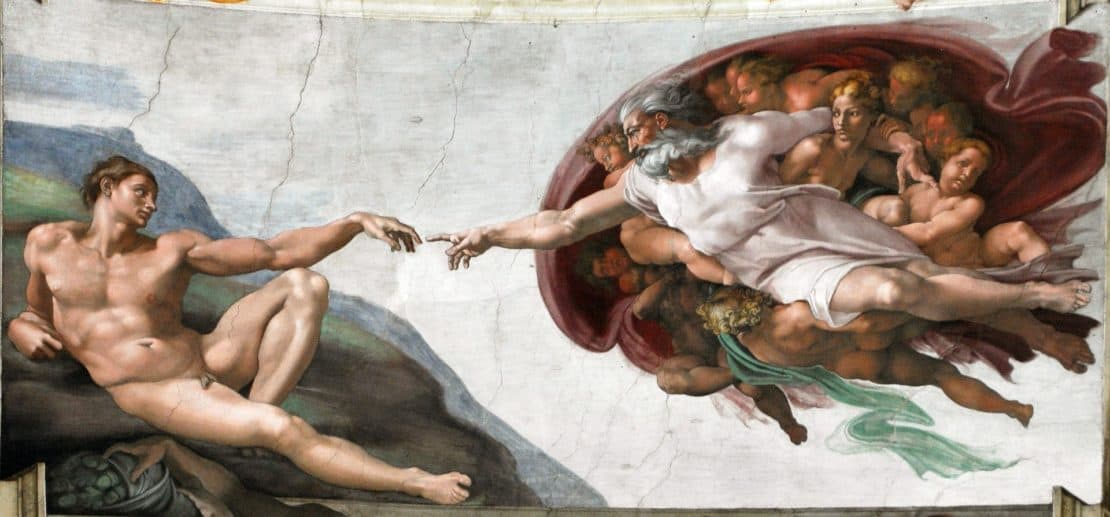 God breathing life into Adam in the Sistine Chapel - a famous Italian landmark