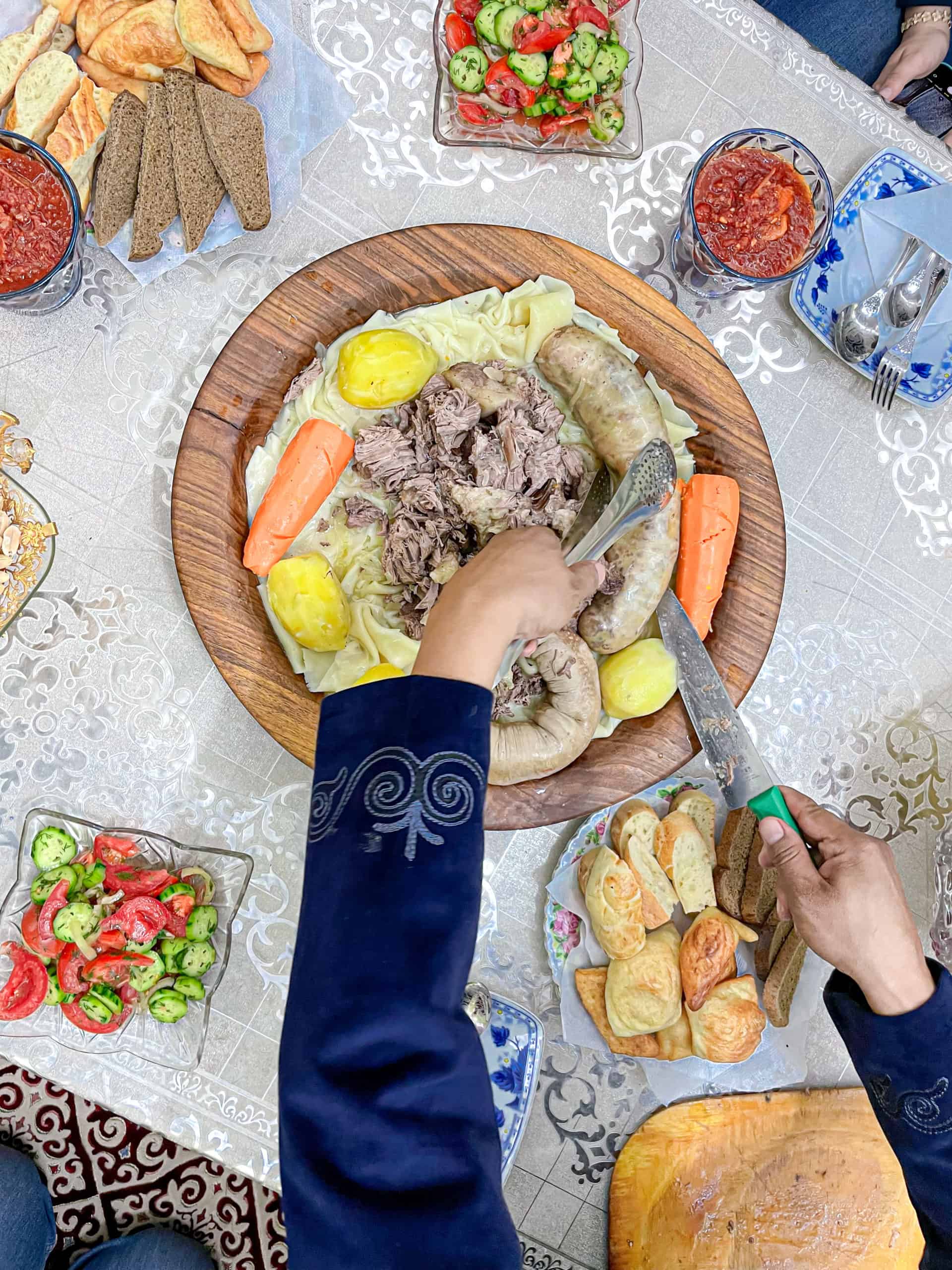 Kazakhstan - Turkistan - Beshbarmak Dinner being carved
