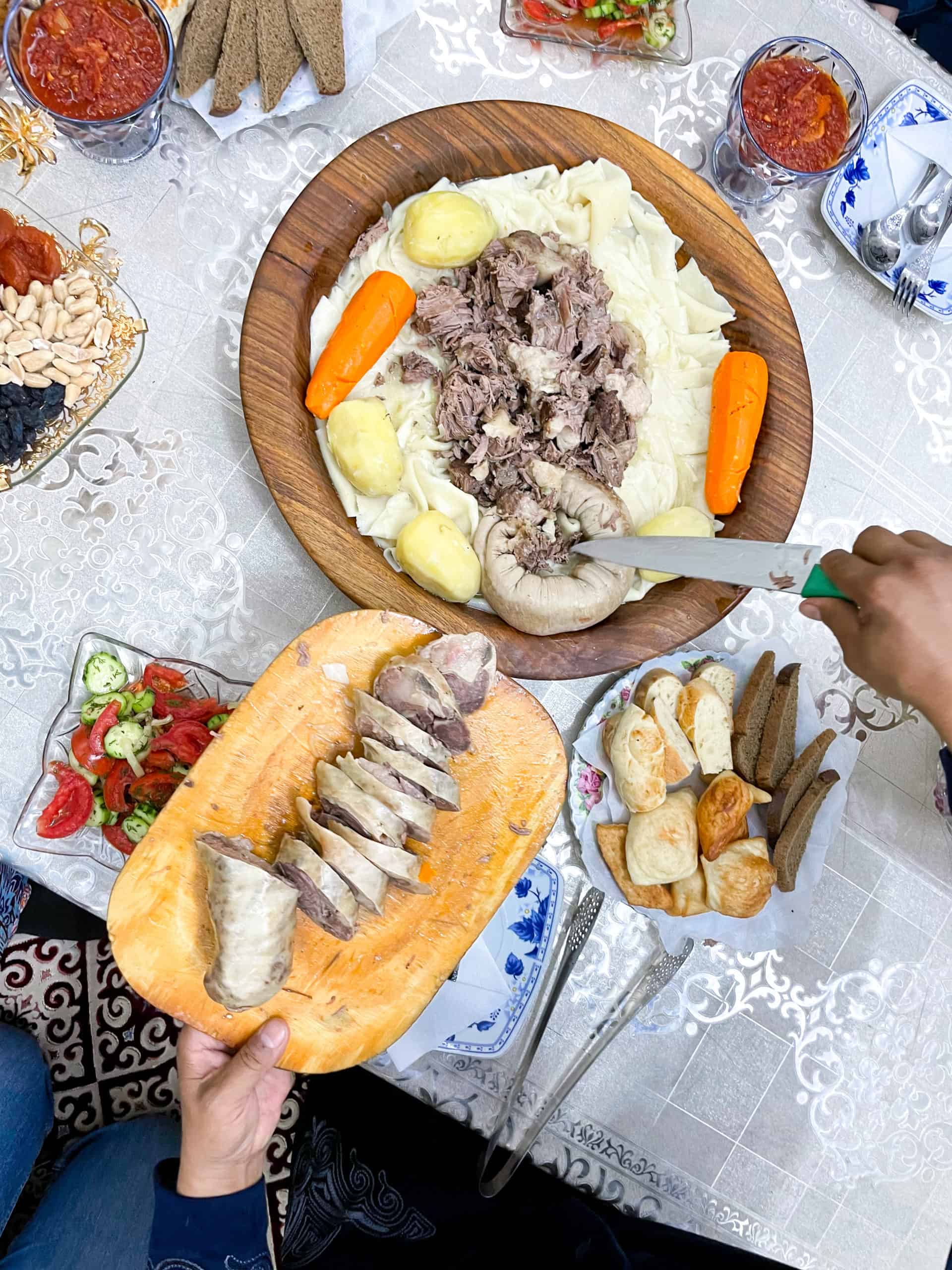 Kazakhstan - Turkistan - Beshbarmak sausage being sliced