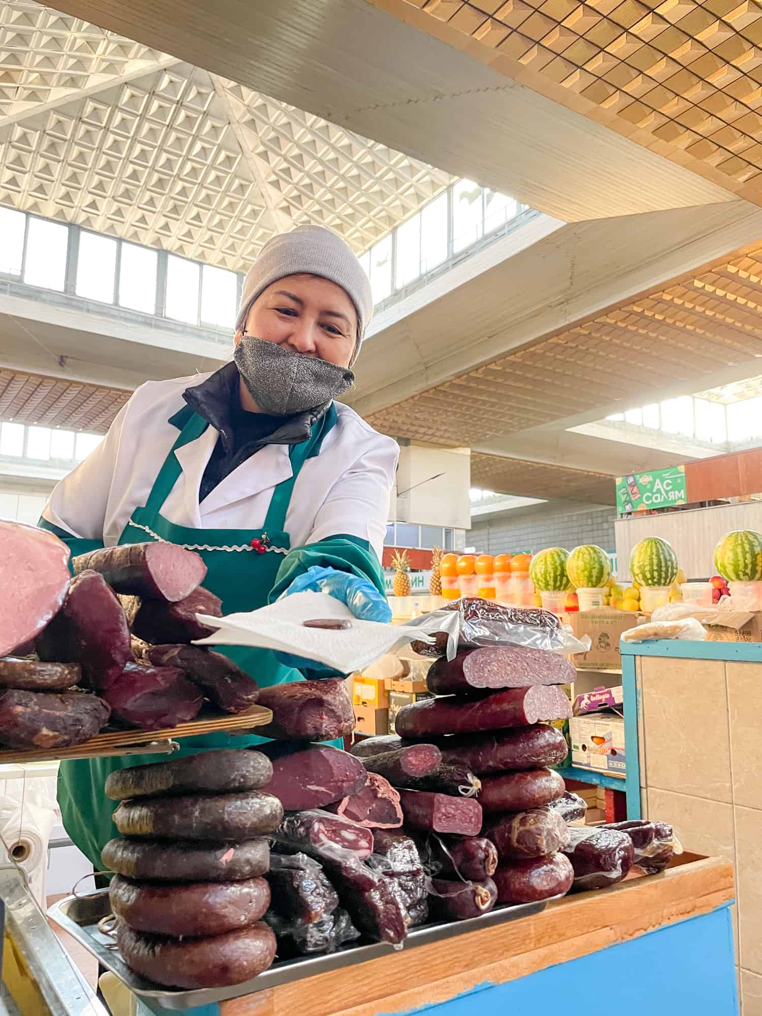 Kazakhstan - Almaty Market - offered a slice of kazy sausage