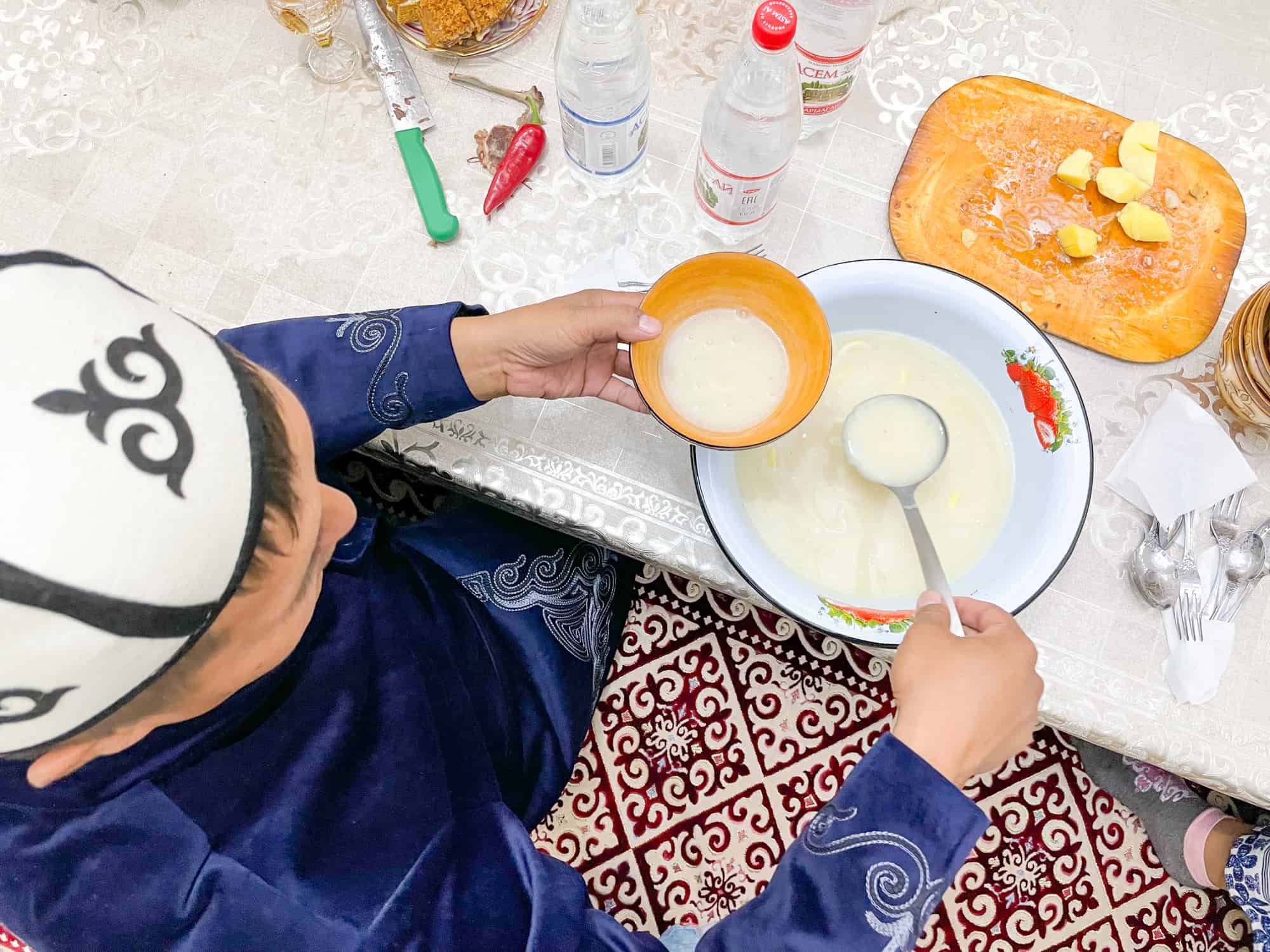 Kazakhstan food - ladling out fermented camel milk