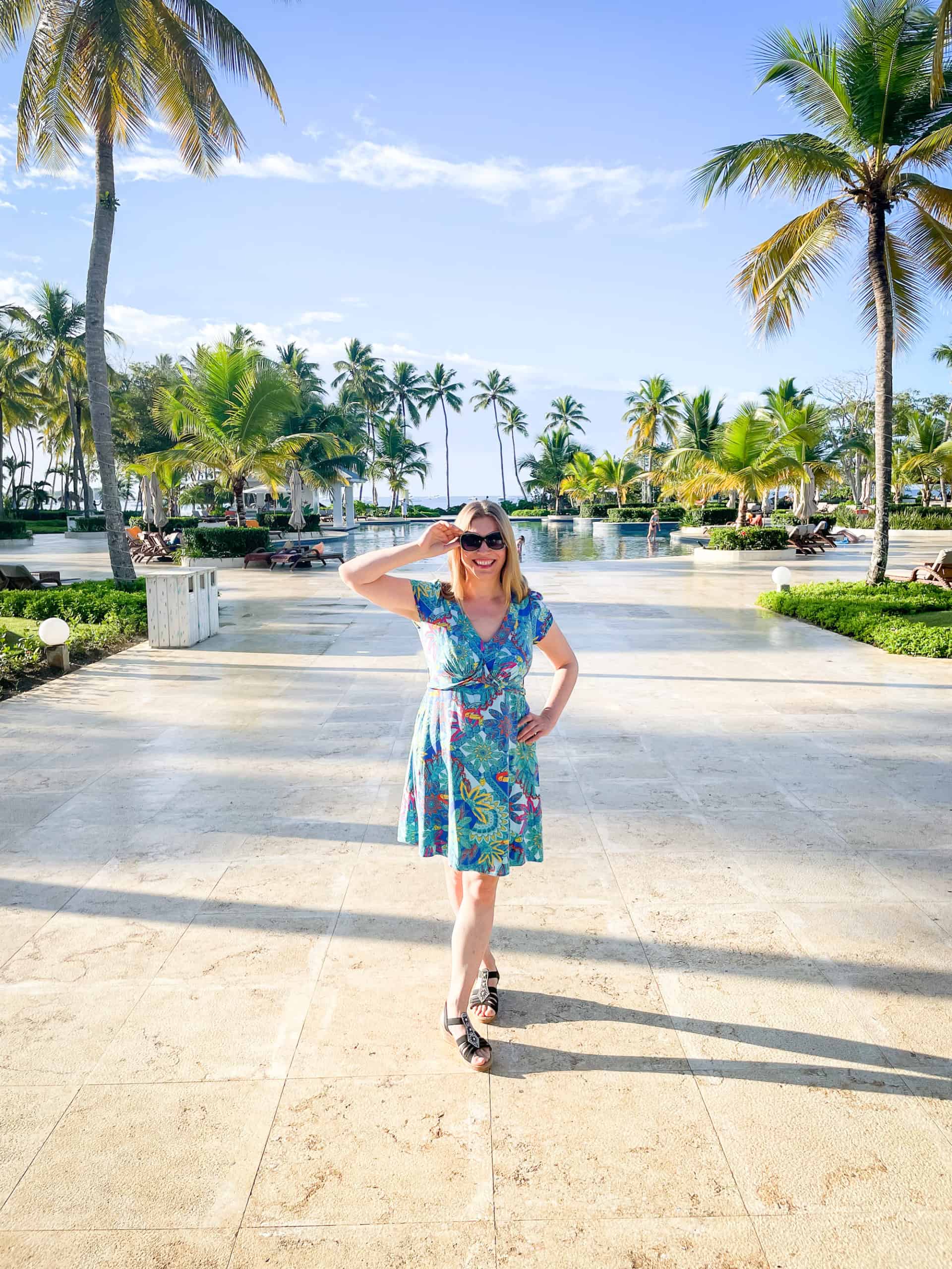 Dominican Republic - Hilton La Romana - Abigail King by main pool with palm trees