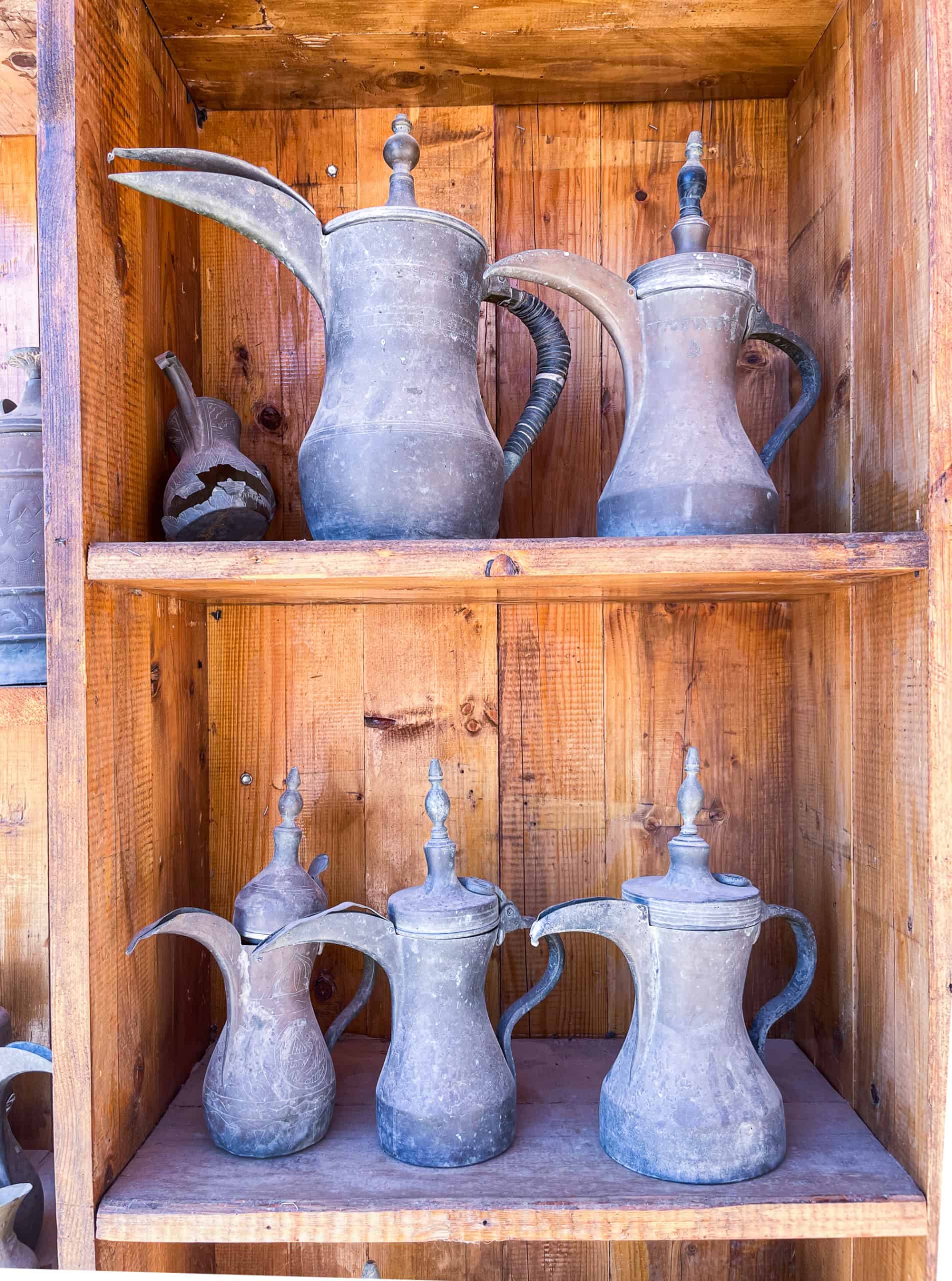 Jordan - line of Bedouin coffee pots for sale