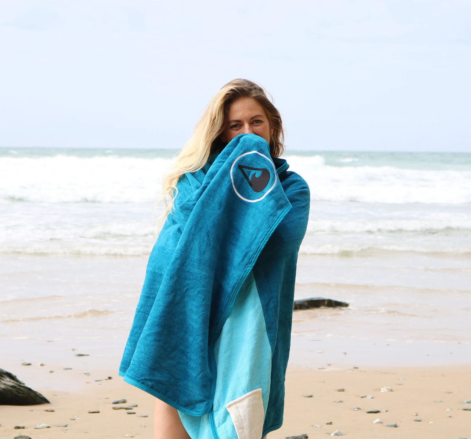 Sustainable beach towel woman on beach