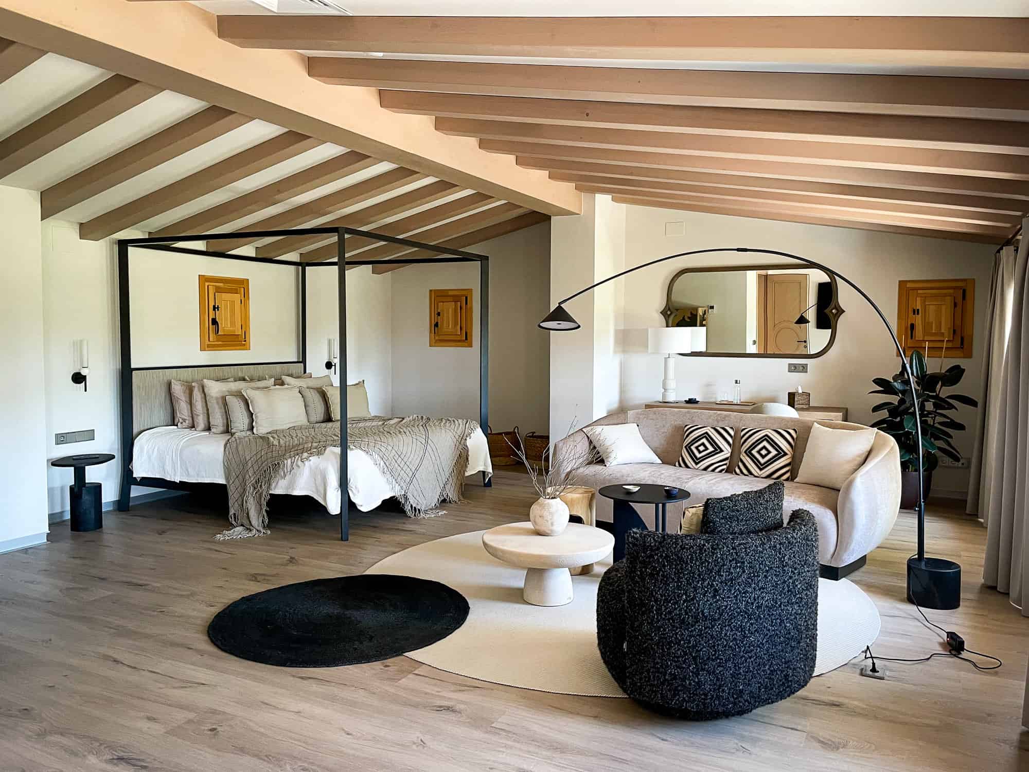 The master bedroom at Masia Cabellut, a luxury villa near Barcelona with a private pool