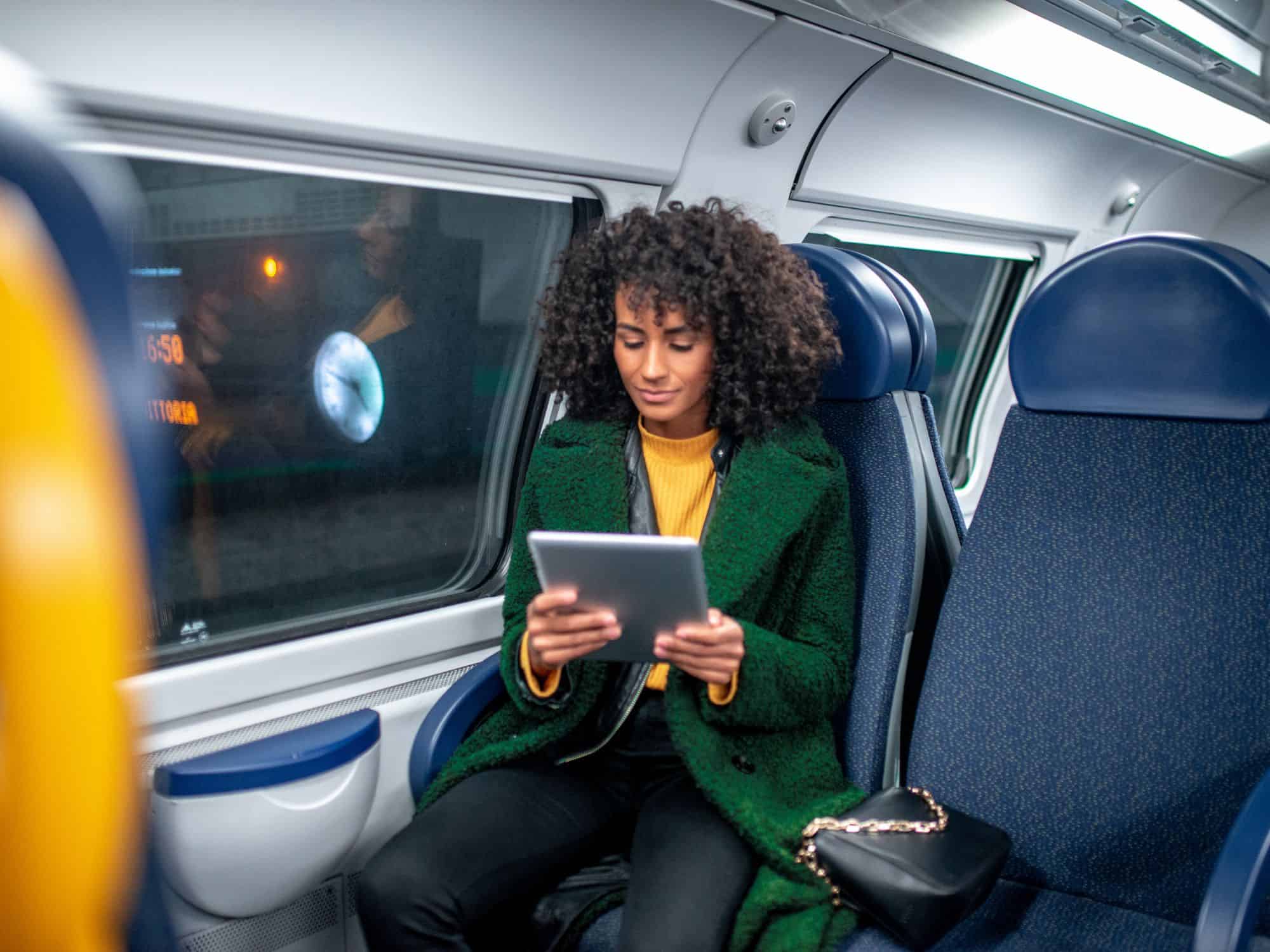 Best business travel safety tips - woman on train