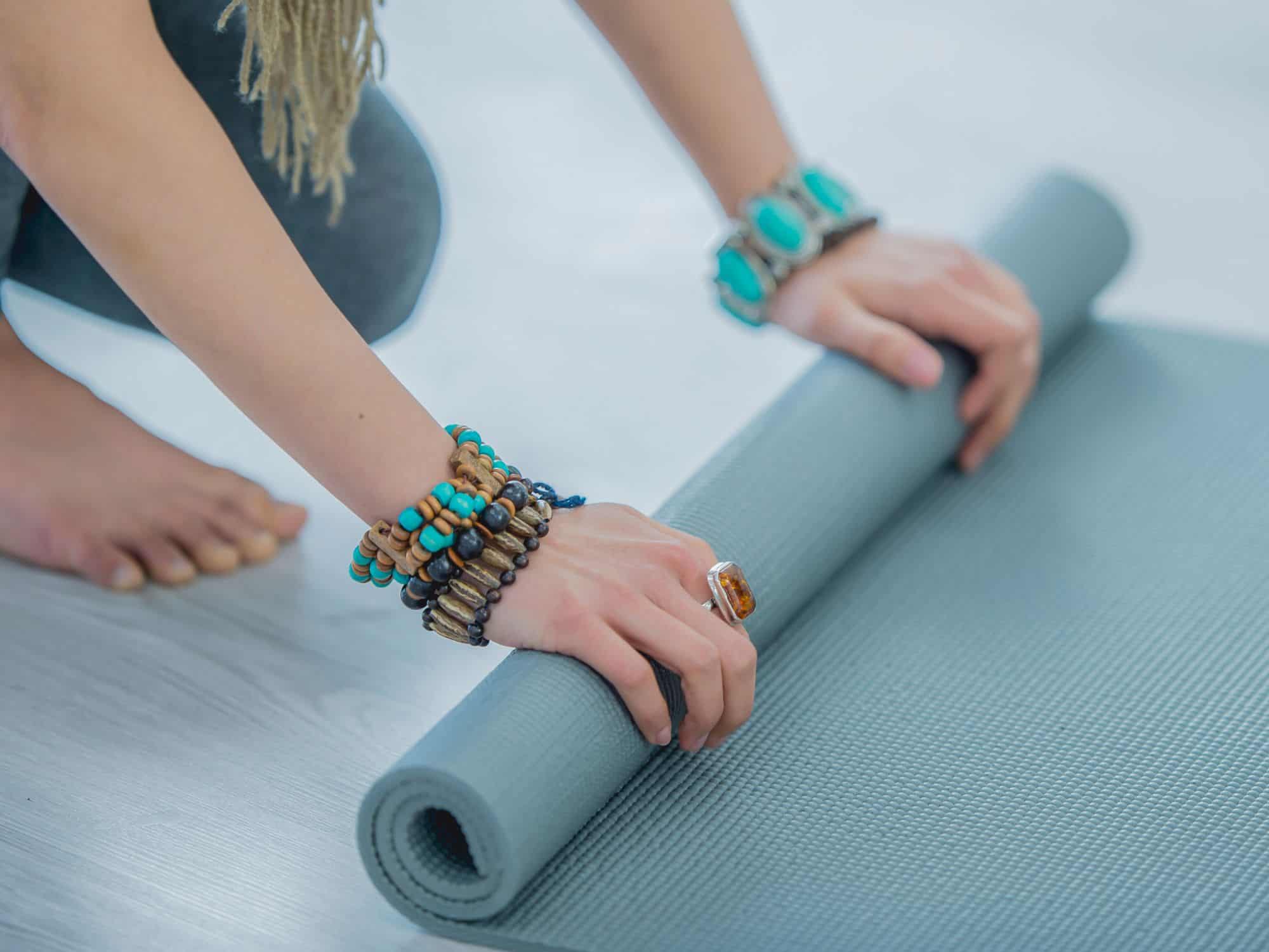 How to travel with a yoga mat - rolling up a mat