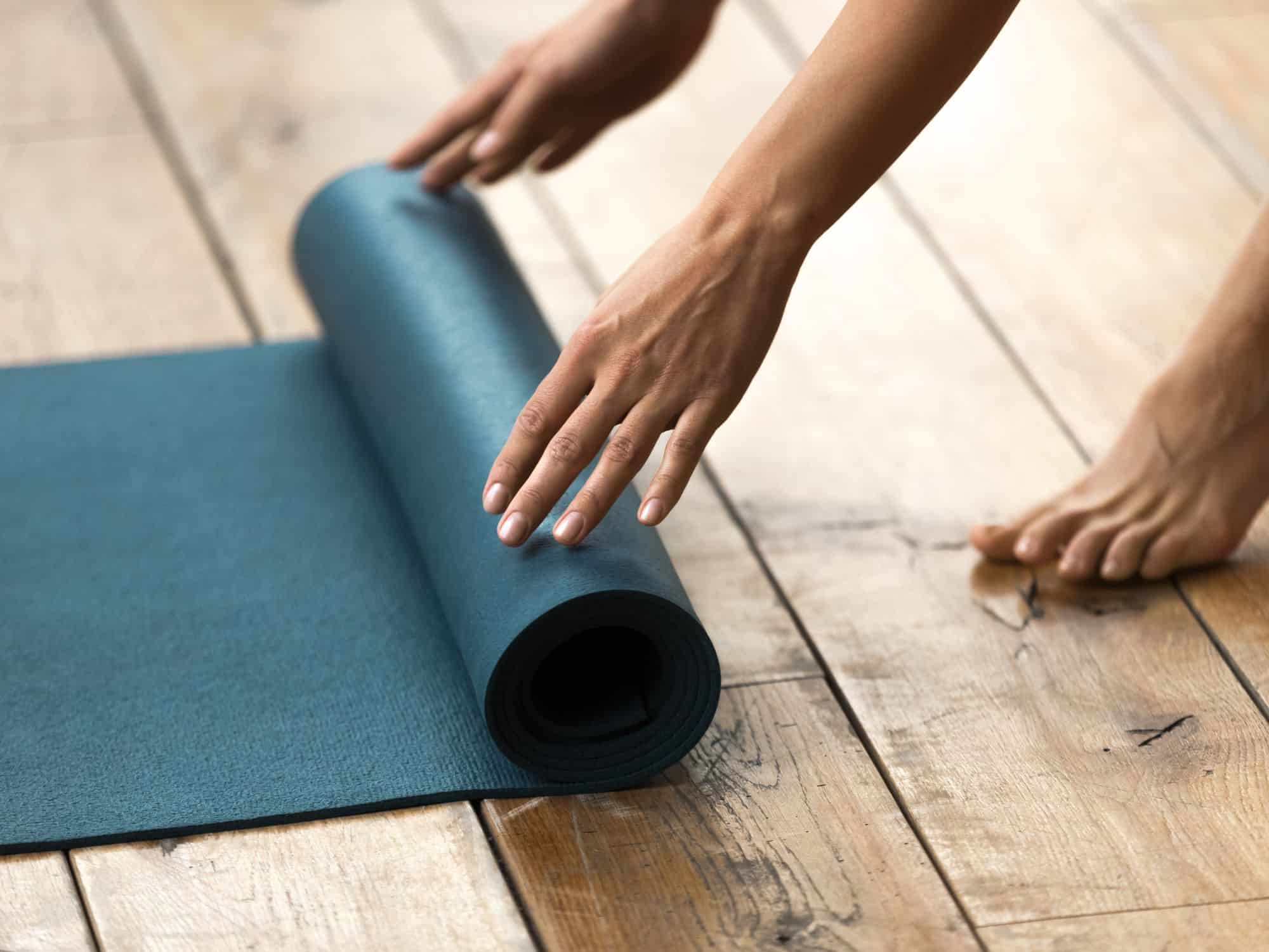 Rolling up a yoga travel mat