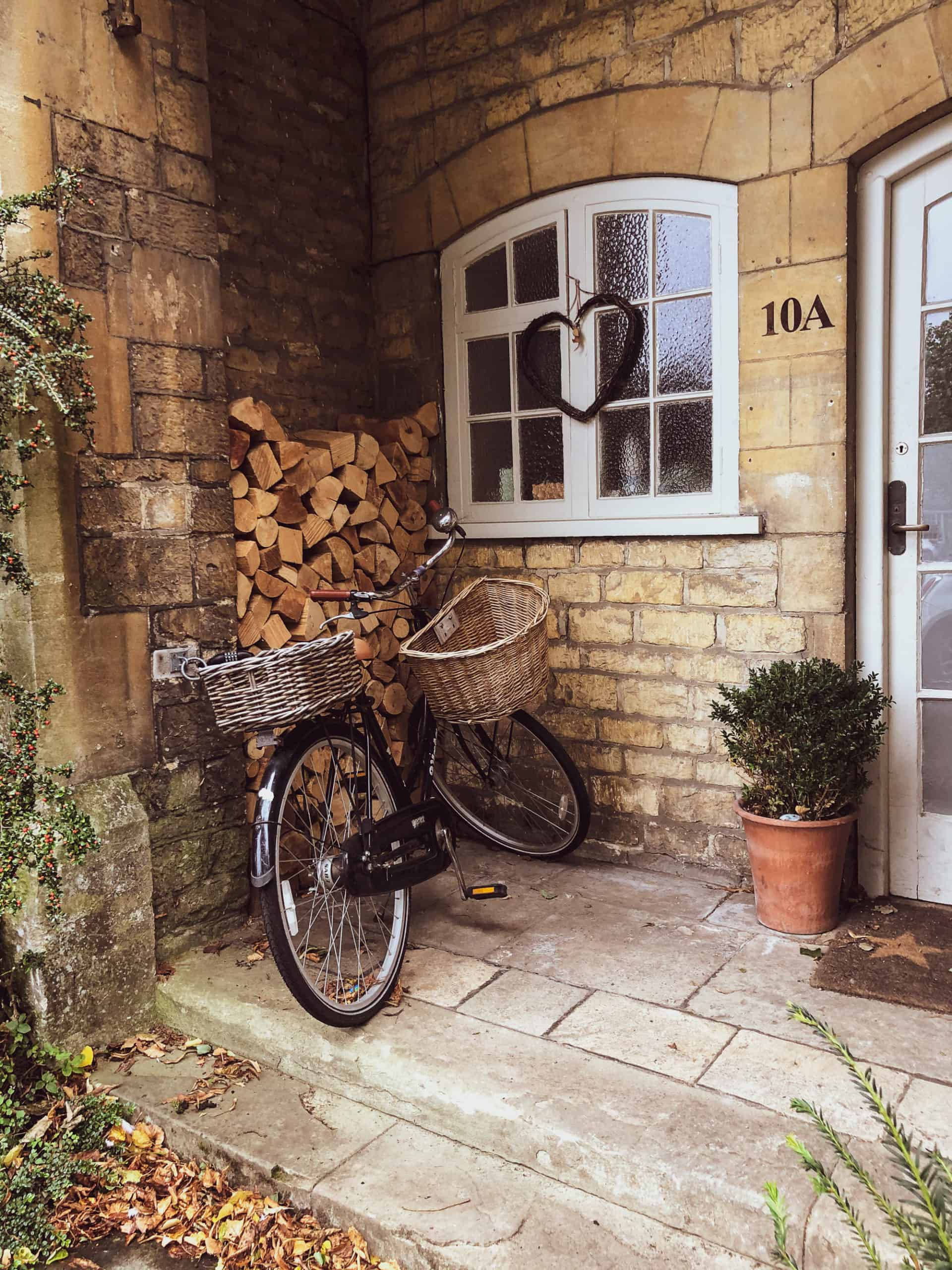 England - the Cotswolds with Kids - cosy doorway with bicycle