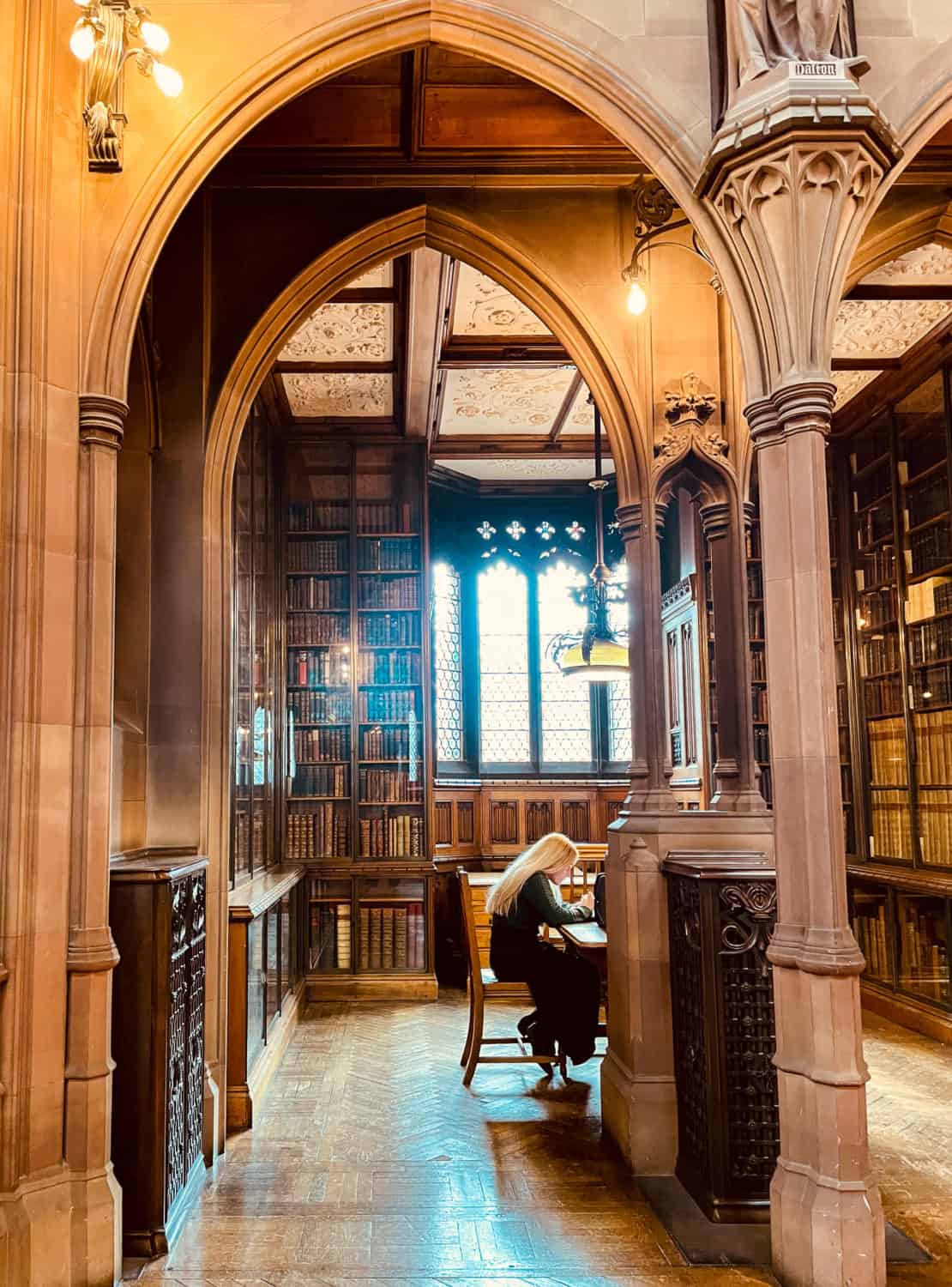 Manchester - Inside John Ryland library, a young woman studies