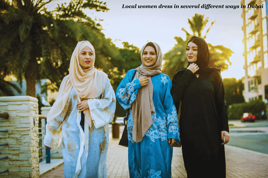 Three local women walking in traditional dress in Dubai - Dubai packing list 