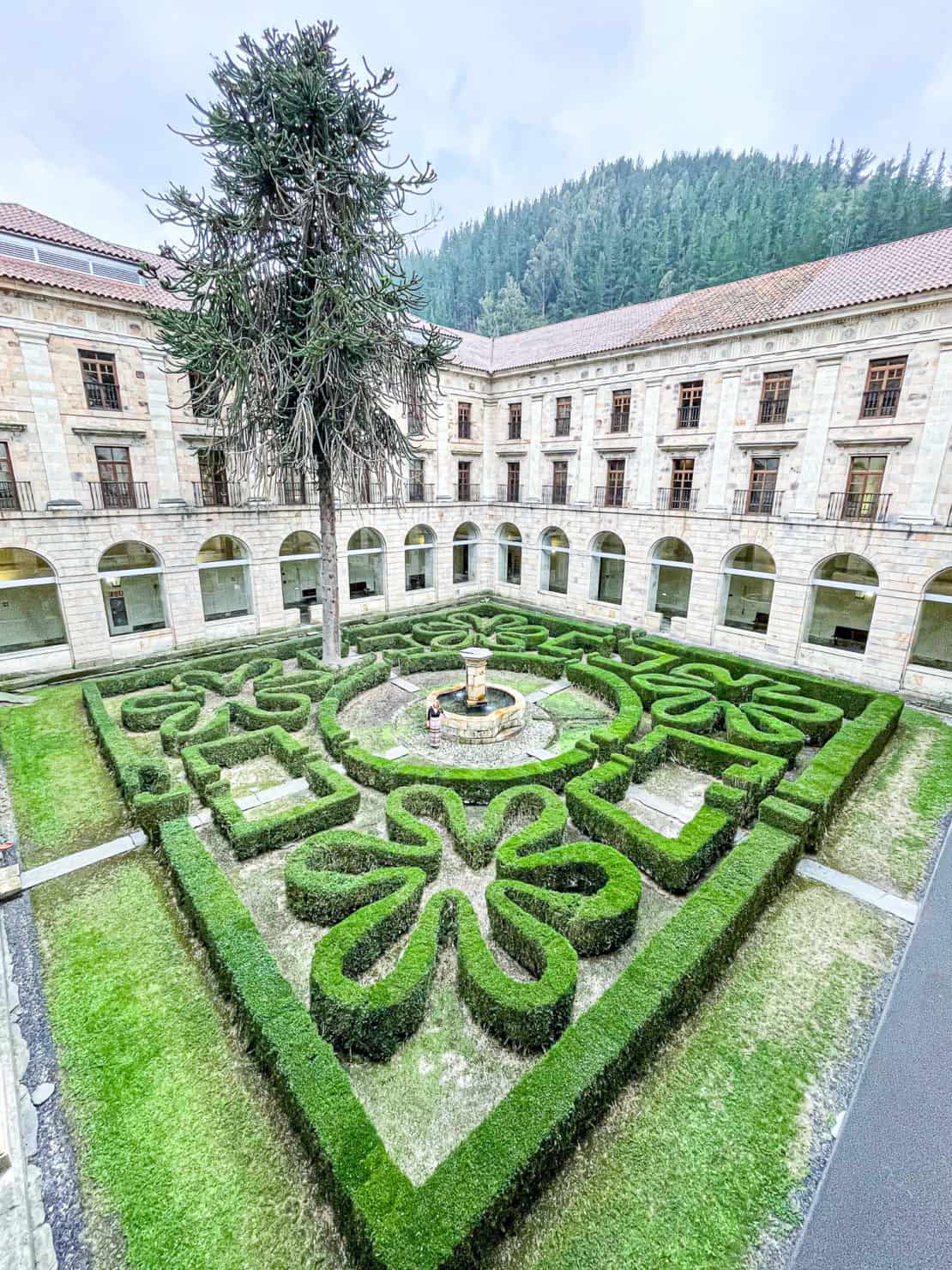 Spain - Asturias - Cangas del Narcea monastery hotel - Abigail King in maze gardens