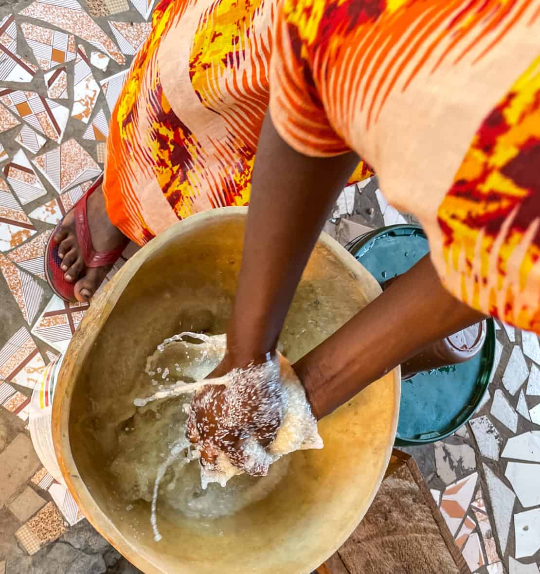 Cleaning cherreh, one of the staple starches in Gambian cuisine