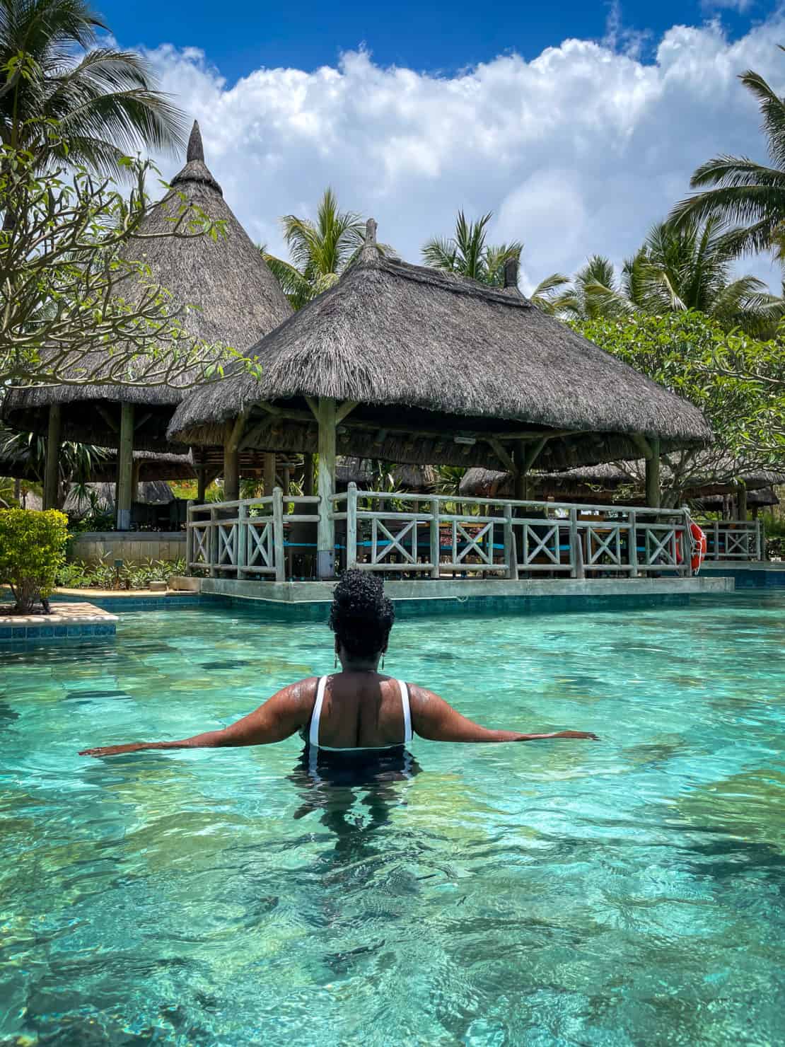 
Bandi swimming by the thatched rooms of La Pirogue in Mauritius