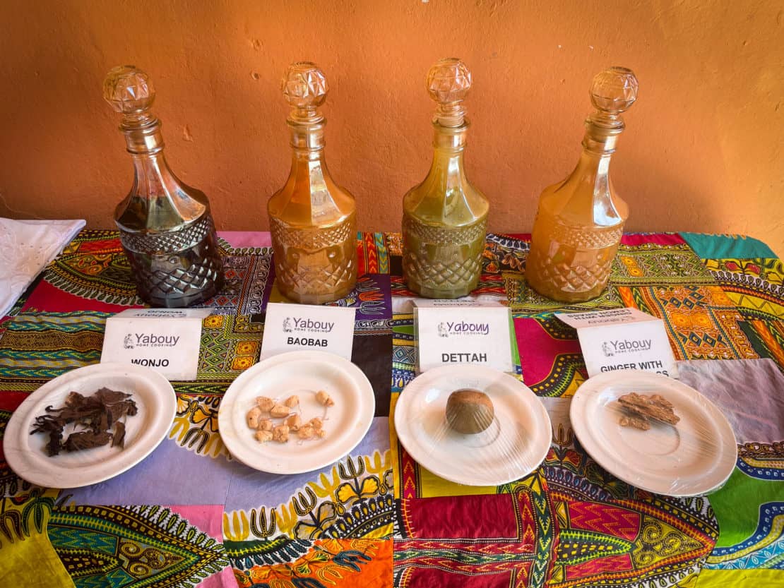 Line up of the most popular traditional drinks in the Gambia with their raw ingredients.