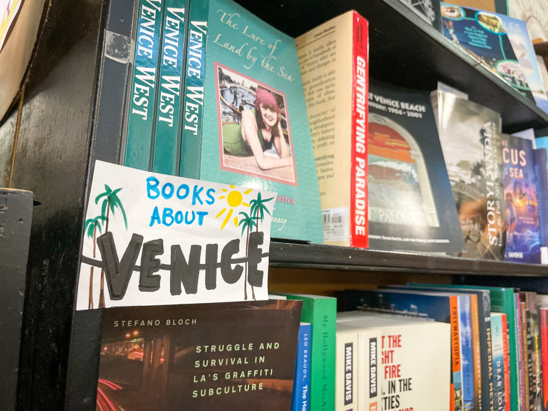 Stack of books about Venice in the Small World Books store in Venice Beach