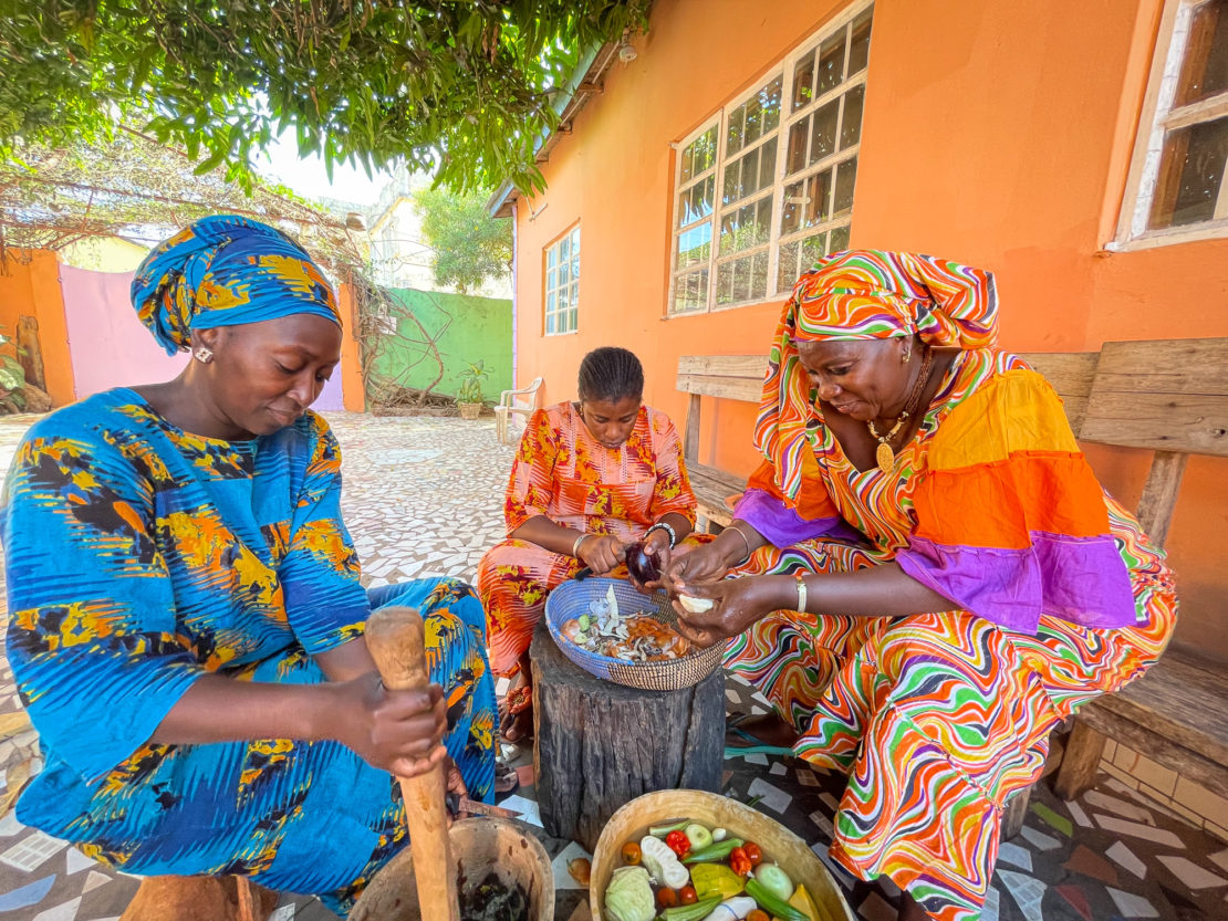 Women preparing vegetables at a cooking lesson in The Gambia