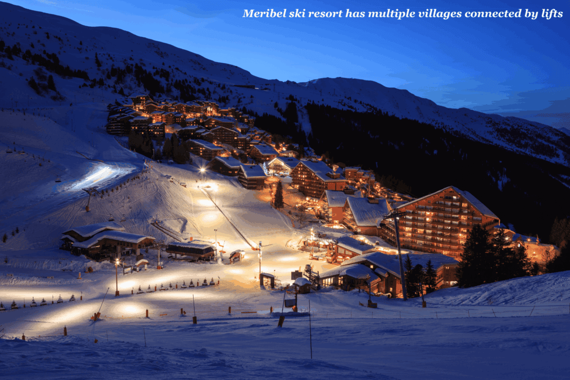Ski chalets lit up at night in Meribel, France - Meribel vs Val Thorens
