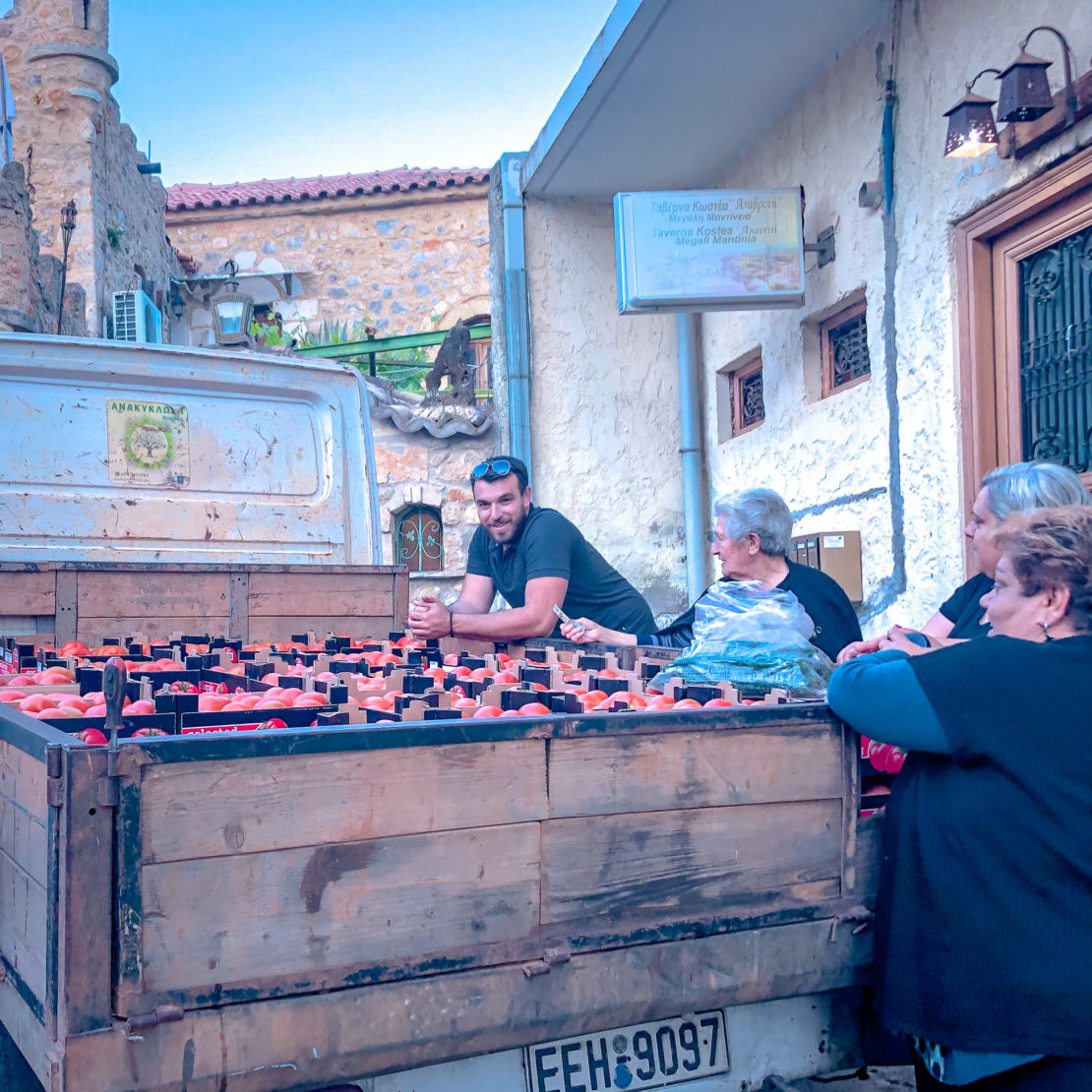 Community selling fresh tomatoes in Greece