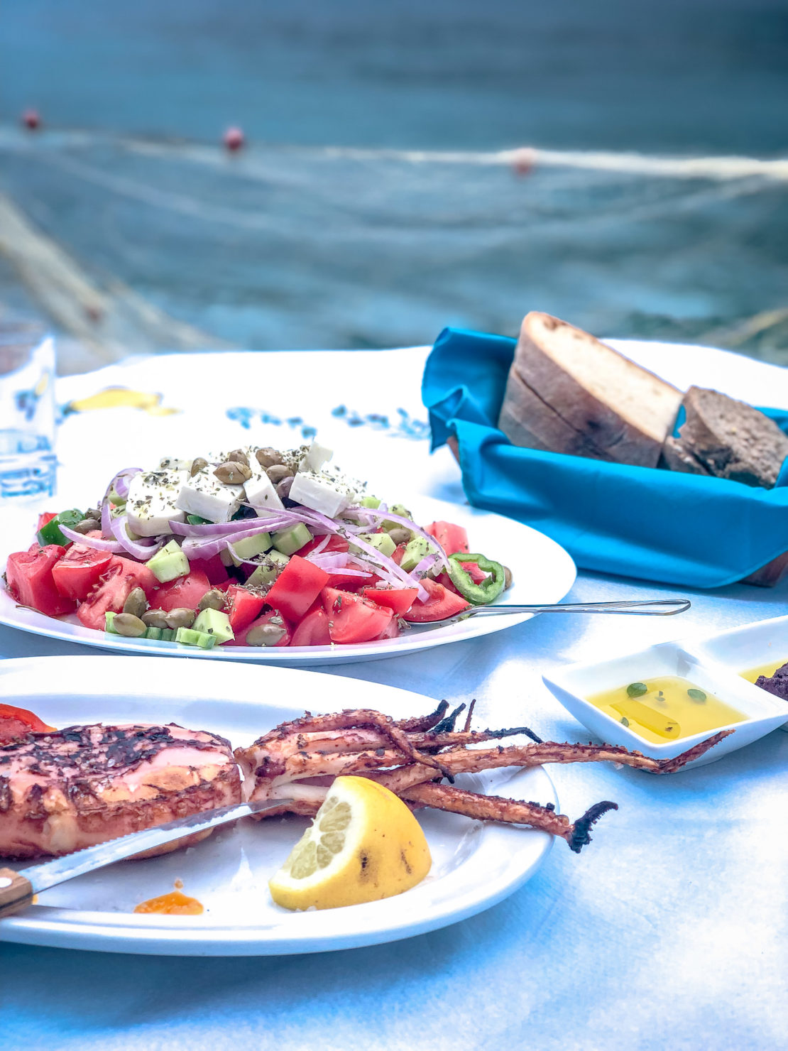 Traditional Greek food seafood platter with Greek salad and feta cheese