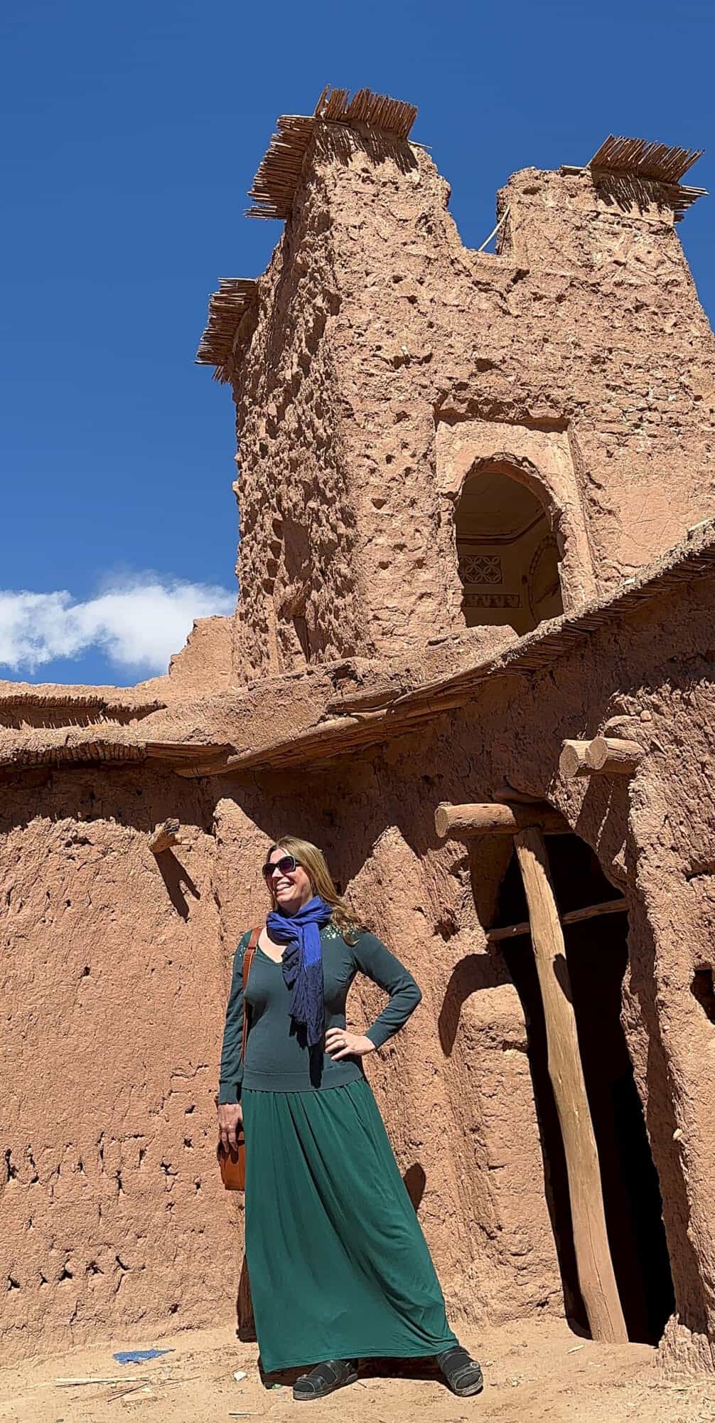 Abigail King standing within UNESCO World Heritage Site Ait Benhaddou as part of a Morocco itinerary
