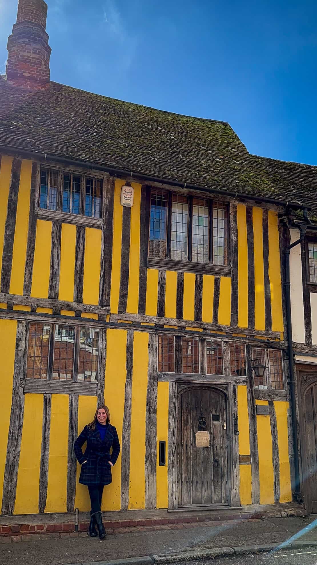 Abigail King outside timbered houses in Lavenham England