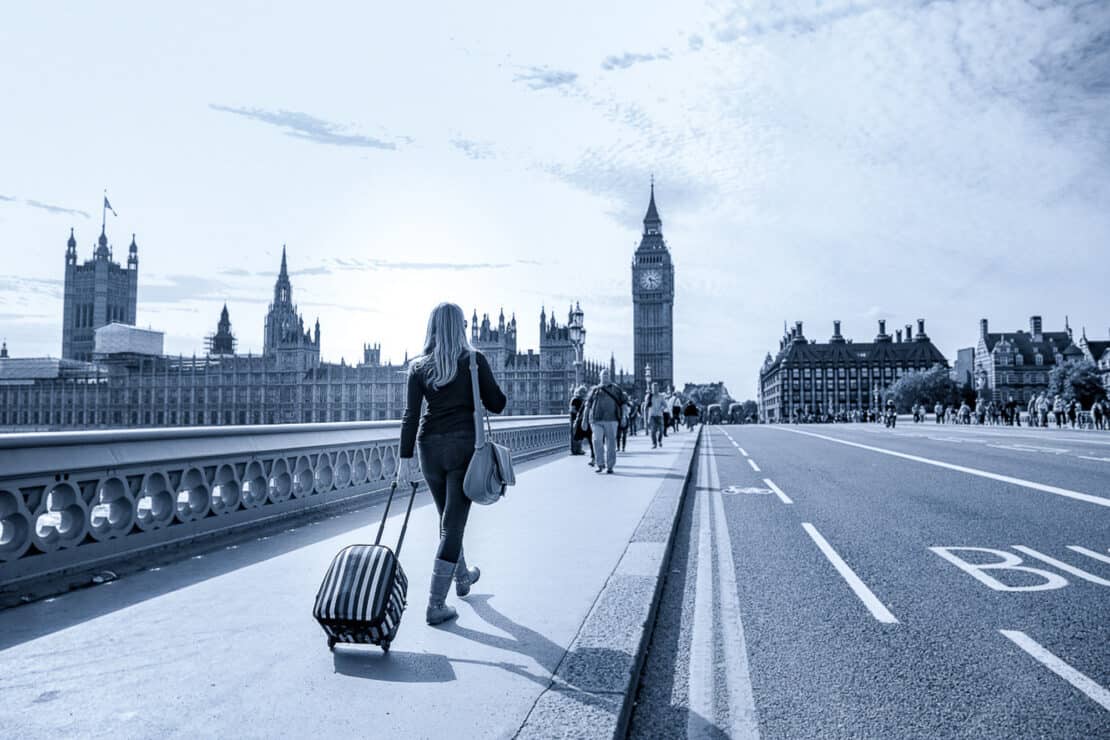 Abigail King striding across the bridge towards Big Ben in London England