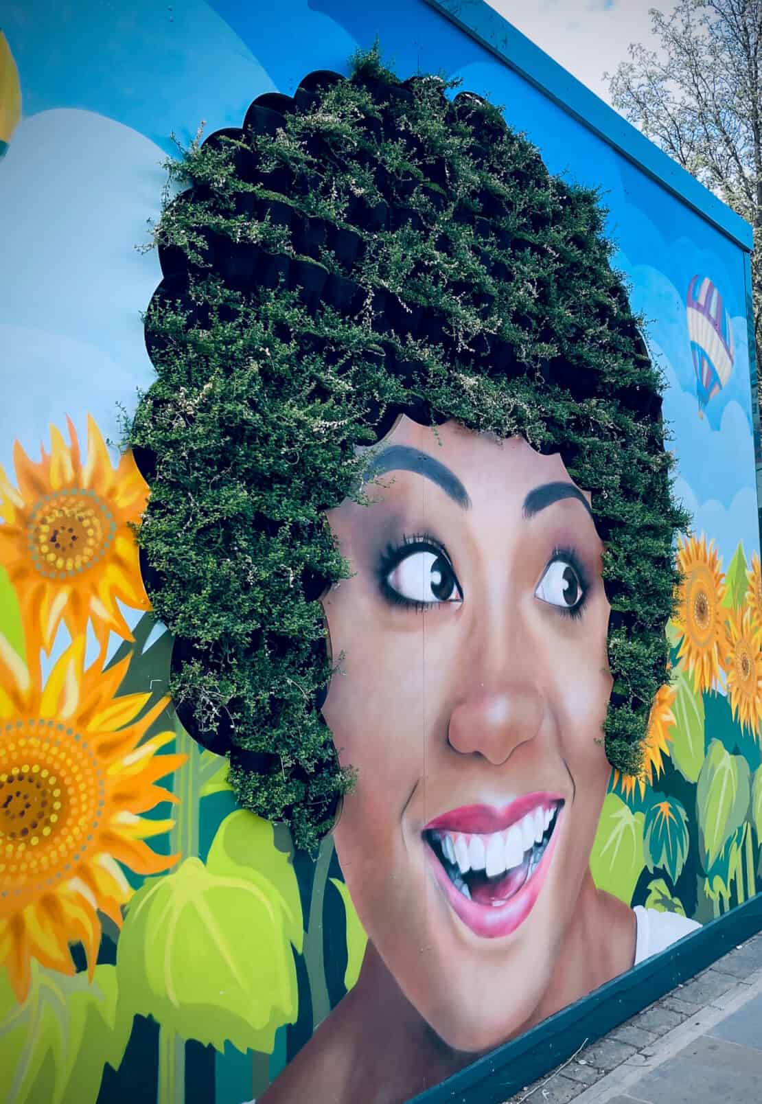 Cool street art in London where plants make up a woman's hair