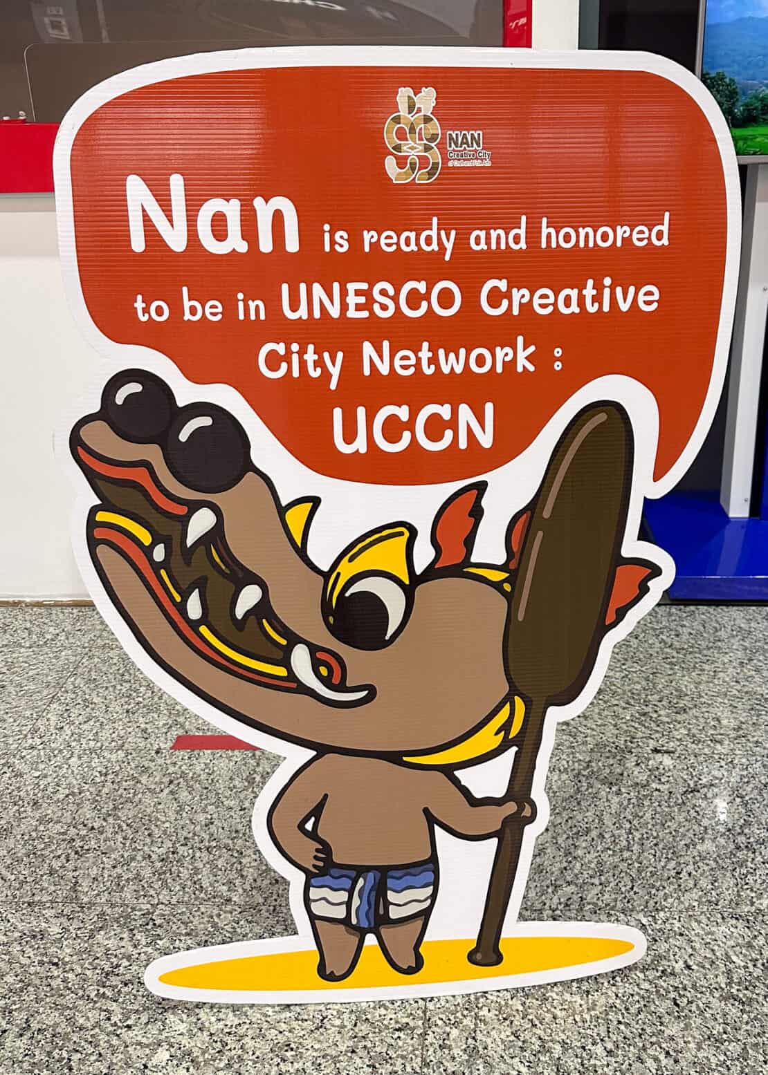 Cardboard cut out cartoon character signpost to Nan
