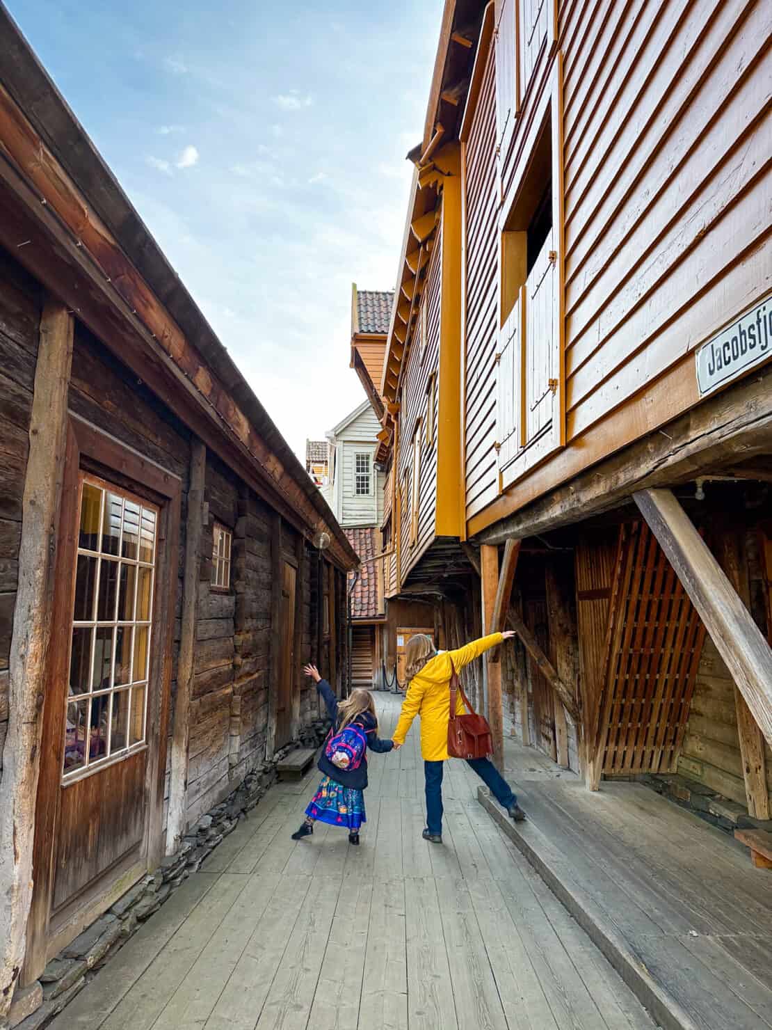 Abigail King and daughter exploring the UNESCO area of Bryggen in Bergen