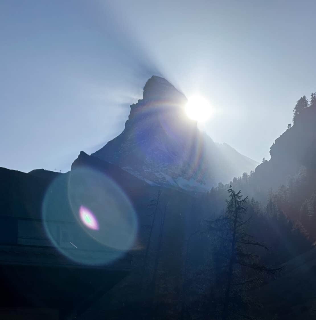 Silhouette of the Matterhorn with sun flares in Switzerland