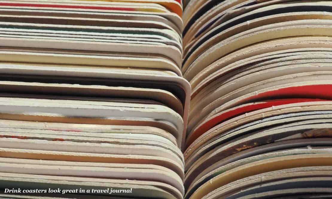 Stacks of colourful cardboard drink coasters 
