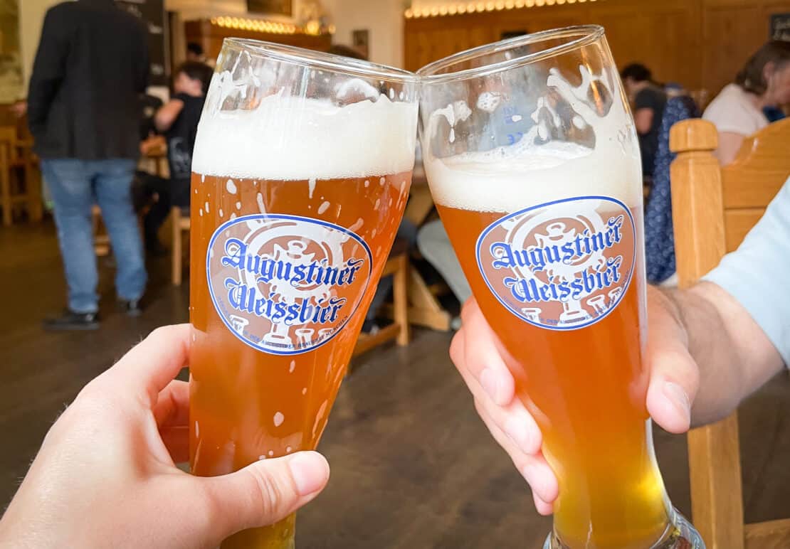Two glasses of Austrian beer clink together to say cheers