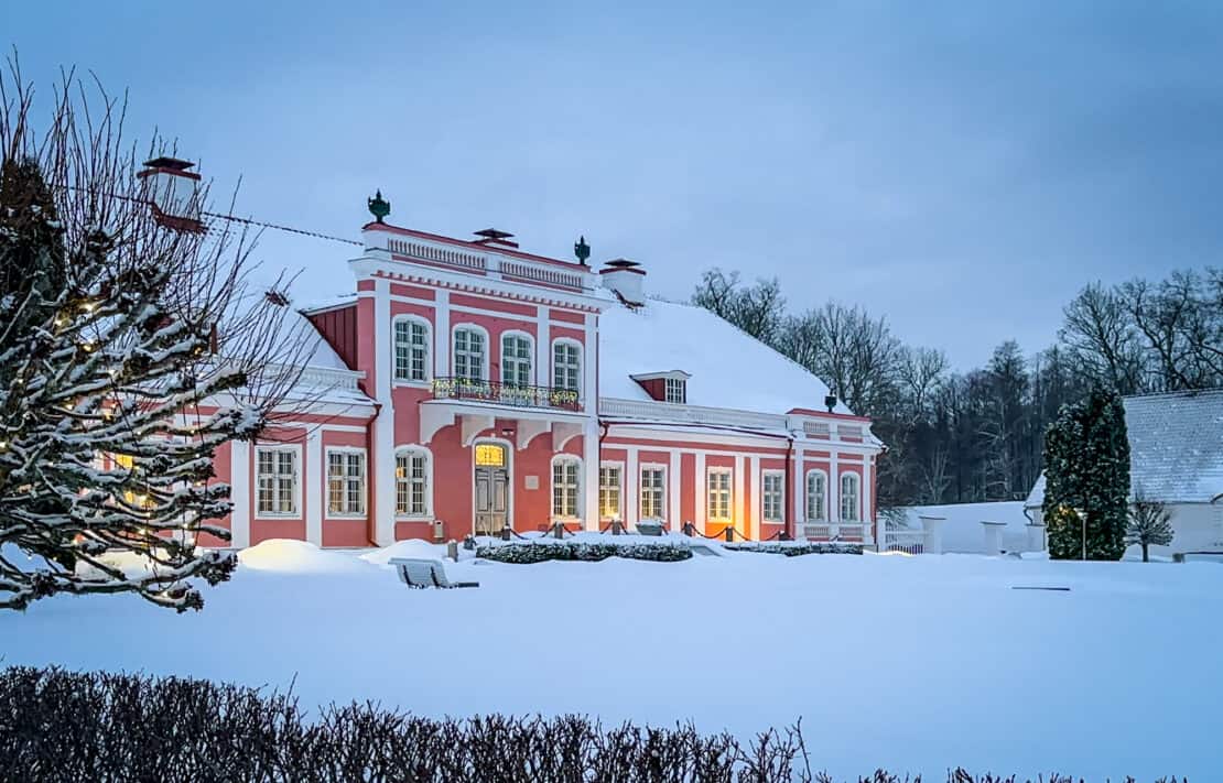Sagadi Manor in Lahemaa National Park in winter with gentle lights in the snow