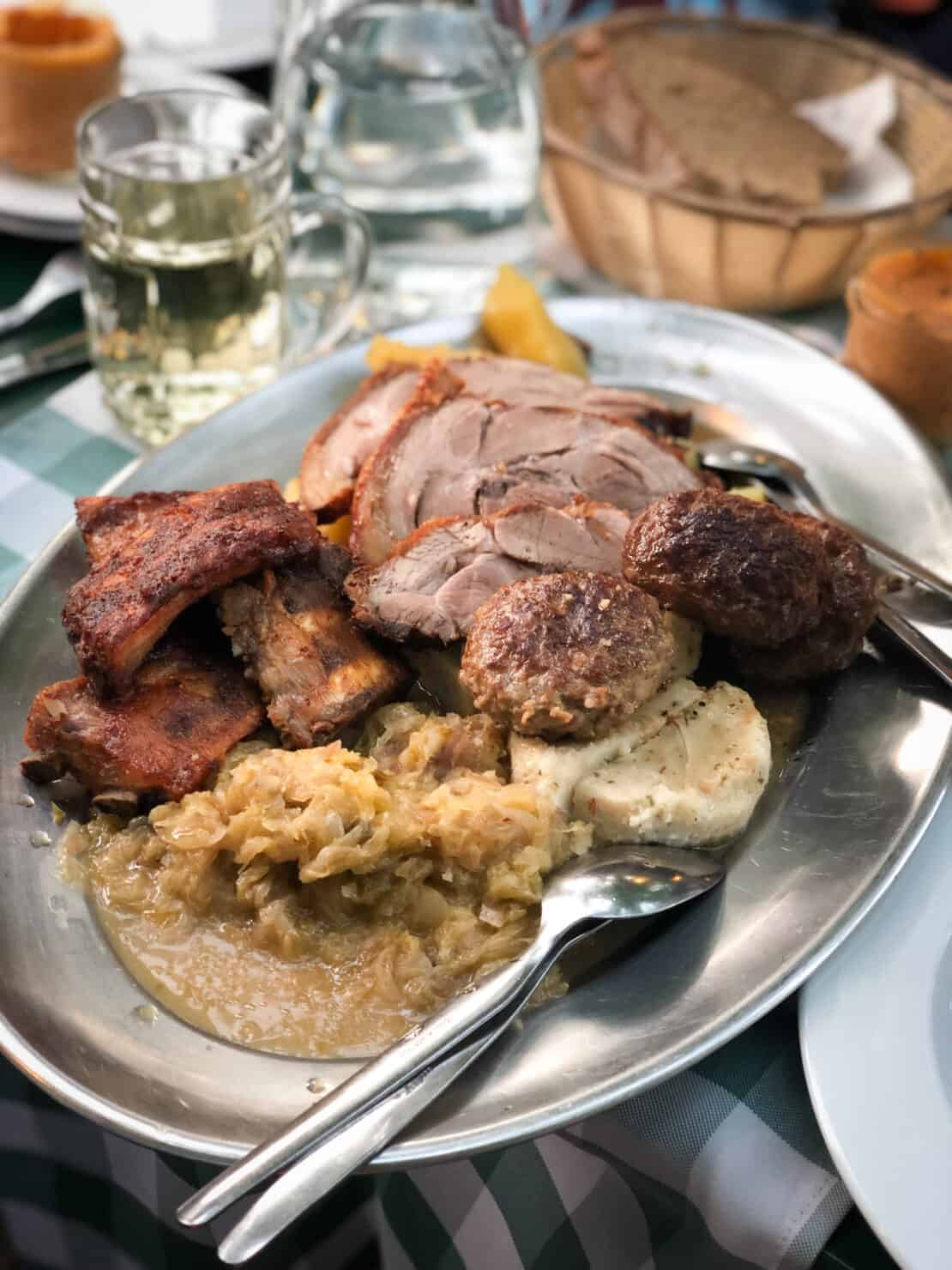 Zwiebelrostbraten Sunday roast dinner on a metal platter near Vienna