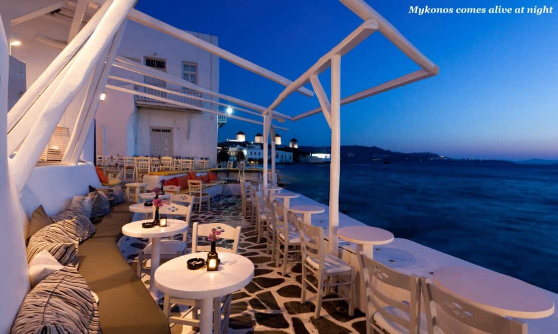 Waterside restaurant at night in Mykonos, Greece